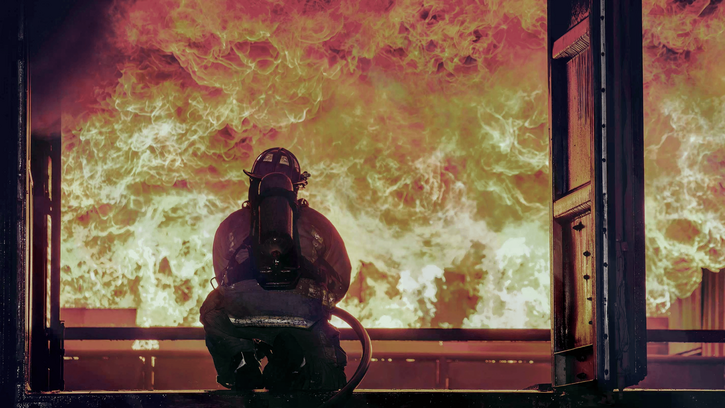 Firefighter extinguishing fire