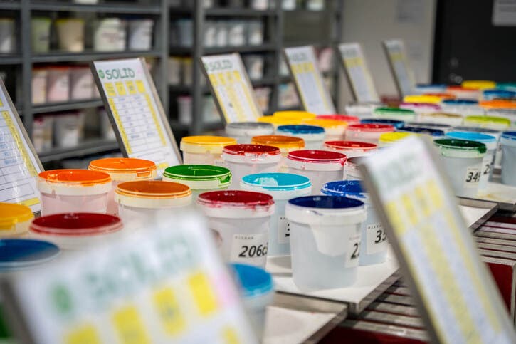 Paint cans lined up in production